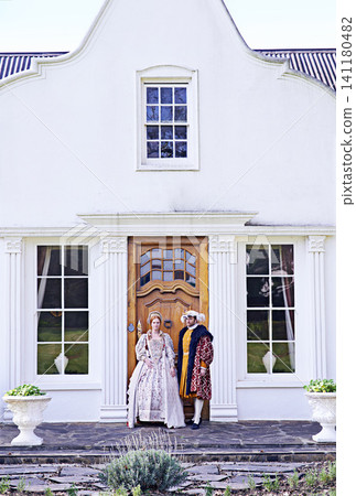 King, renaissance couple and home with Victorian architecture, man and door outdoor with wealth. Real estate, ruler and history with royalty and historical manor with a house and monarch marriage 141180482