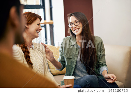Happy woman, friends and laughing with coffee on sofa for funny joke, humor or comedy together. Female person or group with smile in happiness for social bonding, talk or chatting at cafe lounge Happy woman, friends and laughing with coffee on sofa for funny joke, humor or comedy together. Female person or group with smile in happiness for social bonding, talk or chatting at cafe lounge 141180713