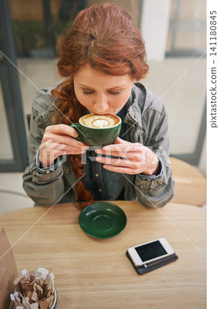 Woman, cappuccino and happy in coffee shop with drink at breakfast to start morning from above at table. Girl, person and cup with flavor, aroma or relax in cafeteria with smile for service in Dublin 141180845