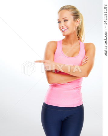 Woman, studio and point for fitness or health information, happiness and mockup space for self care or wellness promotion. Female person, isolated on white background and announcement for exercise Woman, studio and point for fitness or health information, happiness and mockup space for self care or wellness promotion. Female person, isolated on white background and announcement for exercise 141181198