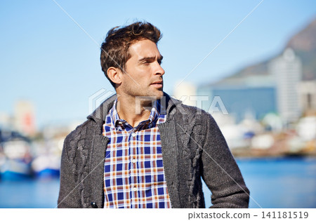 Harbor, ideas and man on travel for vacation, adventure or holiday with memory or reflection. Thinking, outdoor and male person by sea port on weekend trip in Cape Town with planning face expression. Harbor, ideas and man on travel for vacation, adventure or holiday with memory or reflection. Thinking, outdoor and male person by sea port on weekend trip in Cape Town with planning face expression. 141181519