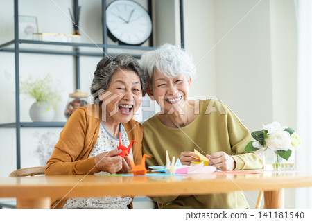 Senior woman doing origami Senior woman doing origami 141181540