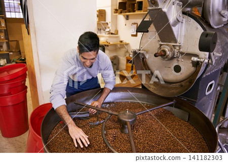 Coffee beans, blend and man with machine for roasting with small business, production and quality control. Entrepreneur, barista or worker with grain at cafe, sustainable startup and espresso process Coffee beans, blend and man with machine for roasting with small business, production and quality control. Entrepreneur, barista or worker with grain at cafe, sustainable startup and espresso process 141182303
