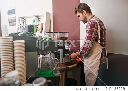 Man, barista and machine in morning in coffee shop with preparation for order, service and catering. Person, server or waiter in cafe for drink, tea or espresso with idea, job and helping in Italy Man, barista and machine in morning in coffee shop with preparation for order, service and catering. Person, server or waiter in cafe for drink, tea or espresso with idea, job and helping in Italy 141182319