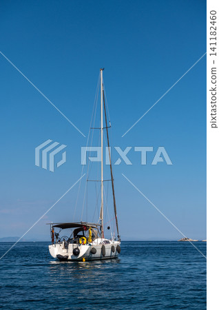 Luxury motor yacht sailing near rocky island in Marmaris Turkey Luxury motor yacht sailing near rocky island in Marmaris Turkey 141182460