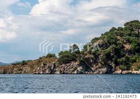 Scenic view of a rocky island coast in Marmaris Turkey Scenic view of a rocky island coast in Marmaris Turkey 141182473