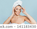 Smiling woman with eye mask 141183430