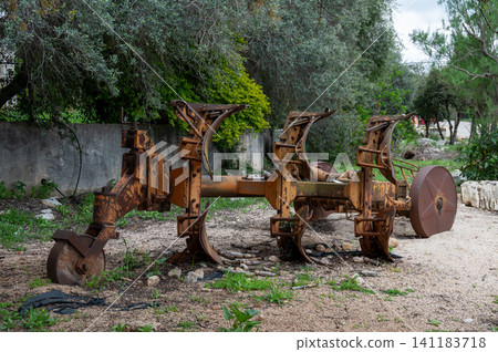 Old rusty agricultural machinery left in a field in Bethlehem of Galilee in Israel 141183718