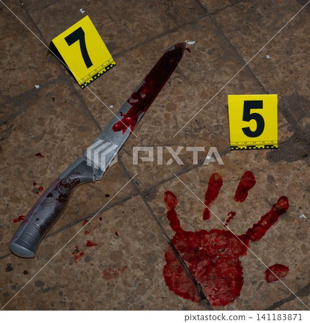 Bloody handprint and bloody knife at crime scene with yellow evidence marker Bloody handprint and bloody knife at crime scene with yellow evidence marker 141183871