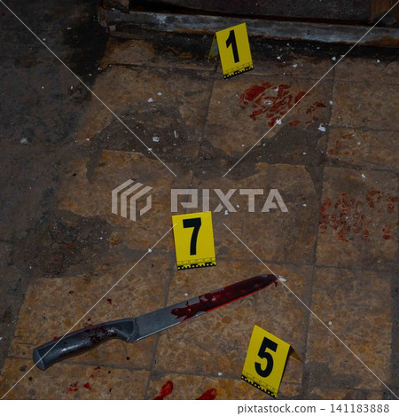 Bloody handprint and bloody knife at crime scene with yellow evidence marker Bloody handprint and bloody knife at crime scene with yellow evidence marker 141183888
