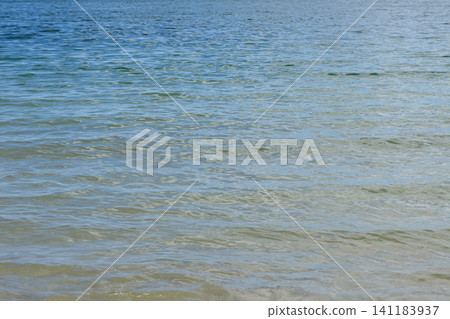 Abstract background material of the sea surface, with a gradient of emerald green and blue. Abstract background material of the sea surface, with a gradient of emerald green and blue. 141183937