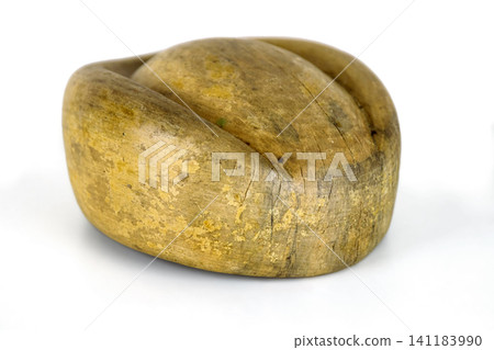 Antique millinery form for shaping pillbox hats. Vintage wooden block used in hat making. Craftsmanship, old professions, artisan work concept. Isolated on white background. Copy space 141183990