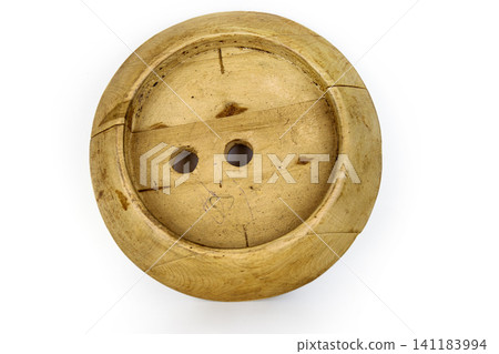 Antique millinery form for shaping wide brim for hats. Vintage wooden block used in hat making. Craftsmanship, old professions, artisan work concept. Isolated on white background. Copy space Antique millinery form for shaping wide brim for hats. Vintage wooden block used in hat making. Craftsmanship, old professions, artisan work concept. Isolated on white background. Copy space 141183994