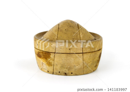 Antique millinery form for shaping pork pie hats. Vintage wooden block used in hat making. Craftsmanship, old professions, artisan work concept. Isolated on white background. Copy space Antique millinery form for shaping pork pie hats. Vintage wooden block used in hat making. Craftsmanship, old professions, artisan work concept. Isolated on white background. Copy space 141183997