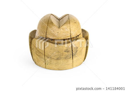 Antique millinery form for shaping pork pie hats. Vintage wooden block used in hat making. Craftsmanship, old professions, artisan work concept. Isolated on white background. Copy space Antique millinery form for shaping pork pie hats. Vintage wooden block used in hat making. Craftsmanship, old professions, artisan work concept. Isolated on white background. Copy space 141184001