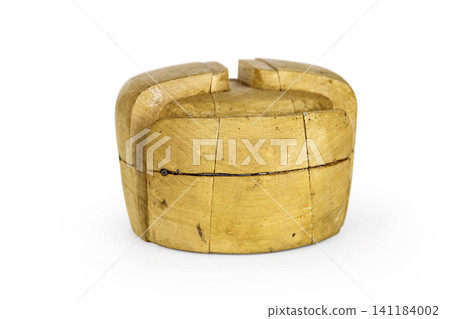 Antique millinery form for shaping ushanka hats. Vintage wooden block used in hat making. Craftsmanship, old professions, artisan work concept. Isolated on white background. Copy space Antique millinery form for shaping ushanka hats. Vintage wooden block used in hat making. Craftsmanship, old professions, artisan work concept. Isolated on white background. Copy space 141184002