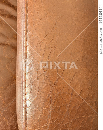 Leather sofa with cracked edges. Leather sofa with cracked edges. 141184144