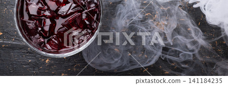 Smoky red cocktail banner ice dark Smoky red cocktail banner ice dark 141184235