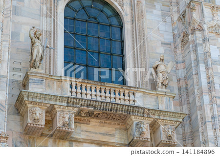 Balcony with a prototype of the Statue of Liberty, Architecture Detail of Milan Cathedral. Duomo di Milano Balcony with a prototype of the Statue of Liberty, Architecture Detail of Milan Cathedral. Duomo di Milano 141184896