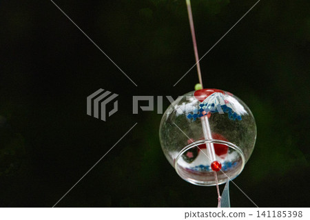 Wind chimes swaying gently in the breeze Wind chimes swaying gently in the breeze 141185398