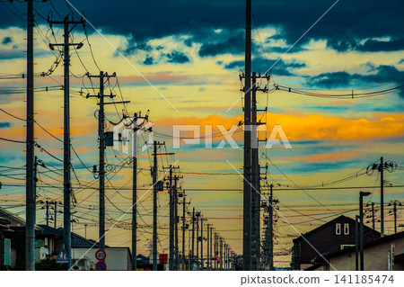 Power lines lined up against the blue sky Power lines lined up against the blue sky 141185474