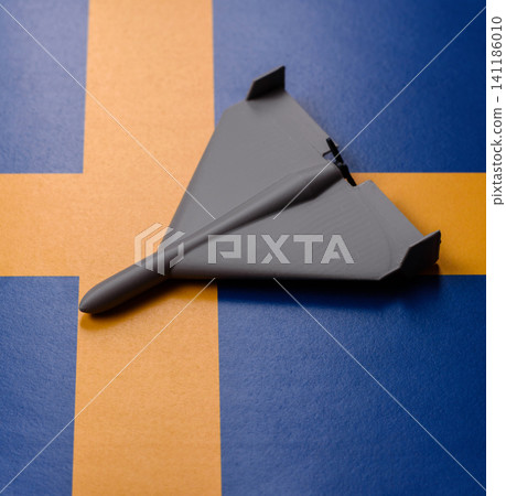 A Shahed drone featuring a prohibition symbol on the Sweden flag, conceptual background for defense A Shahed drone featuring a prohibition symbol on the Sweden flag, conceptual background for defense 141186010