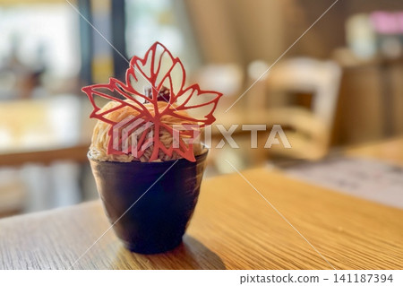 A Mont Blanc dessert decorated with maple leaf cookies. A Mont Blanc dessert decorated with maple leaf cookies. 141187394
