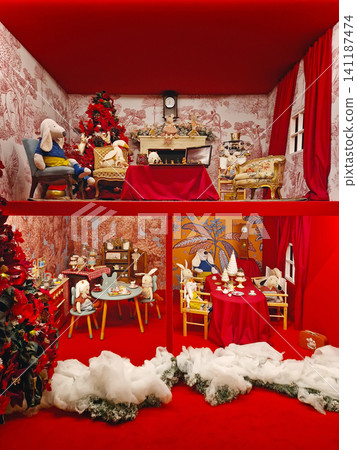 Maincy, France - December 11, 2025: Whimsical dollhouse with plush figures in festive rooms decorated for Christmas, creating a enchanting holiday setting, inside the historic Vaux-le-Vicomte Chateau Maincy, France - December 11, 2025: Whimsical dollhouse with plush figures in festive rooms decorated for Christmas, creating a enchanting holiday setting, inside the historic Vaux-le-Vicomte Chateau 141187474