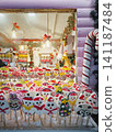 Chisinau, Moldova - January 10, 2026: A festive market stall with vibrant wrapped lollipops shaped like snowmen. Charming Christmas holiday confectionery atmosphere 141187484