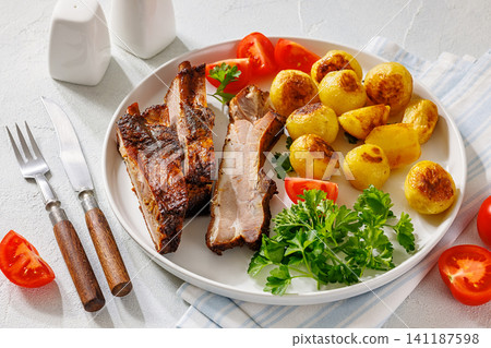 Bavarian Style Baked Pork Ribs with potatoes Bavarian Style Baked Pork Ribs with potatoes 141187598