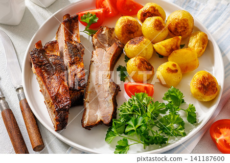 American Diner Roasted Pork Ribs with potatoes 141187600