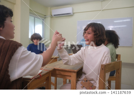 The young children are learning in the classroom. The young children are learning in the classroom. 141187639