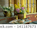 Vintage still life on an old wooden porch with wildflowers and an old book 141187673
