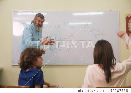 The young children are learning in the classroom. The young children are learning in the classroom. 141187718