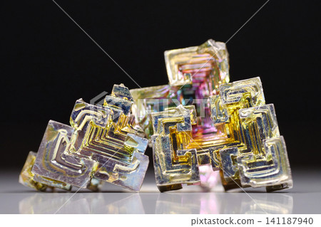 Bismuth crystals. Bismuth - chemical element with symbol Bi and atomic number 83 Bismuth crystals. Bismuth - chemical element with symbol Bi and atomic number 83 141187940
