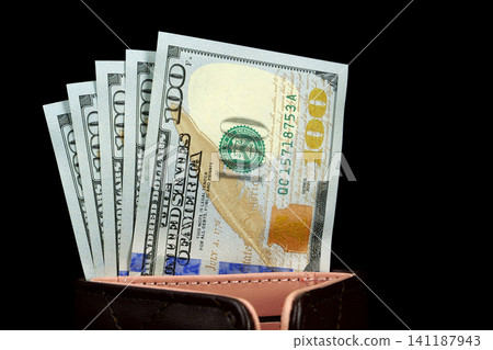 Hundred-dollar bills inside a leather wallet Hundred-dollar bills inside a leather wallet 141187943