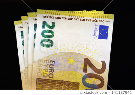 European Money. 800 Euros in four 200 euro banknotes. Cash, finance, savings, wealth. Two hundred Euro banknotes. Euro banknotes, EUR European Money. 800 Euros in four 200 euro banknotes. Cash, finance, savings, wealth. Two hundred Euro banknotes. Euro banknotes, EUR 141187945