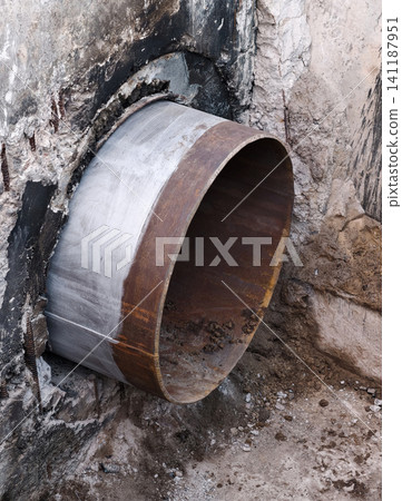 Technical maintenance on main city pipeline with cut metal section exposing chamber and internal pipe structure Technical maintenance on main city pipeline with cut metal section exposing chamber and internal pipe structure 141187951