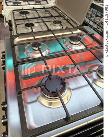 Various models of gas stoves are sold in an appliance store Various models of gas stoves are sold in an appliance store 141187992