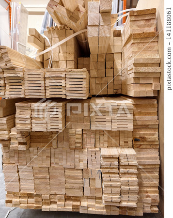 Timber materials, wooden planks and other wood products displayed in rows on warehouse shelves Timber materials, wooden planks and other wood products displayed in rows on warehouse shelves 141188061