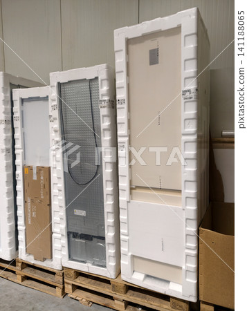 New various sized refrigerators in packaging arranged on pallets inside a store warehouse New various sized refrigerators in packaging arranged on pallets inside a store warehouse 141188065