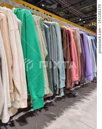 Modern activewear shop displaying bright warm sports outerwear with colorful jackets and fashionable clothing for winter fitness and outdoor recreation Modern activewear shop displaying bright warm sports outerwear with colorful jackets and fashionable clothing for winter fitness and outdoor recreation 141188178