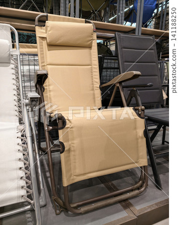 Folding chairs for fishing and tourism displayed in hypermarket provide portable seating comfort durable construction and practical design for outdoor activities and travel use Folding chairs for fishing and tourism displayed in hypermarket provide portable seating comfort durable construction and practical design for outdoor activities and travel use 141188250