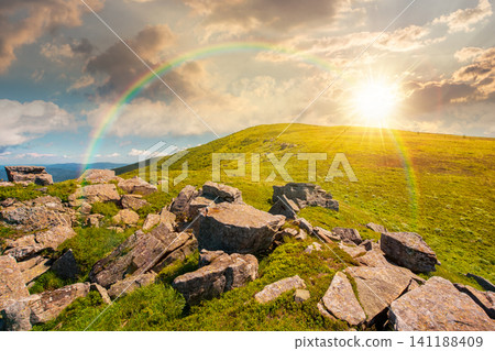 sunset over carpathian mountain landscape in summer. nice background for outdoor adventure in evening light. transcarpathia green hill with rocks sunset over carpathian mountain landscape in summer. nice background for outdoor adventure in evening light. transcarpathia green hill with rocks 141188409