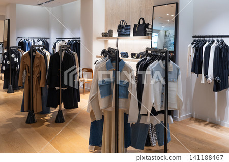 Fashion boutique interior with stylish clothes and accessories Fashion boutique interior with stylish clothes and accessories 141188467