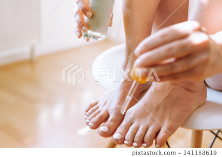 foot skin care peeling, massage, moisturizing 141188619