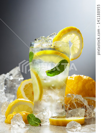 Carbonated refreshing drink with fresh lemon, ice and mint. Carbonated refreshing drink with fresh lemon, ice and mint. 141188955