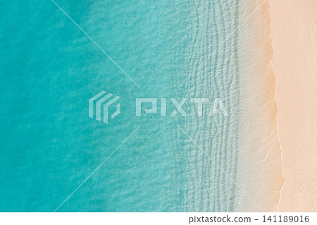 Minimal aerial gradient of turquoise lagoon fading into white sandy shore. Smooth color transition of tropical shallow water and beach from directly overhead, serene abstract seascape. Calm natural Minimal aerial gradient of turquoise lagoon fading into white sandy shore. Smooth color transition of tropical shallow water and beach from directly overhead, serene abstract seascape. Calm natural 141189016