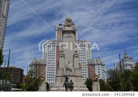Monumental plaza historic statue in madrid with highrise background for travel poster and city banner design Monumental plaza historic statue in madrid with highrise background for travel poster and city banner design 141189488