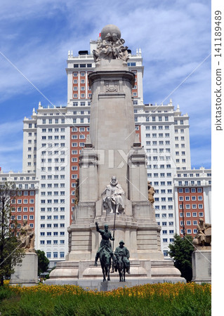 Central madrid monument with equestrian statues and tall background building for travel background and poster design Central madrid monument with equestrian statues and tall background building for travel background and poster design 141189489